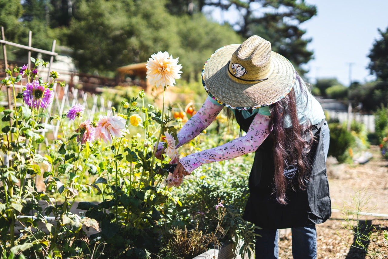 A woman tending to her flowers.